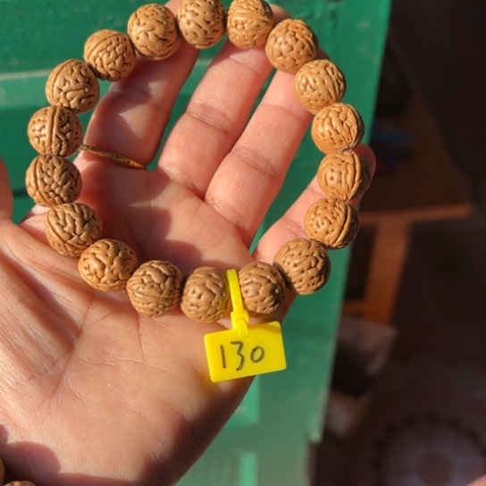 西***吕木质野生桃核手串