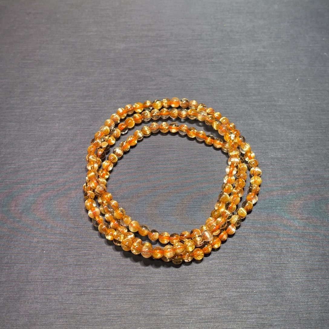 用***7未镶嵌水晶手链金钛晶