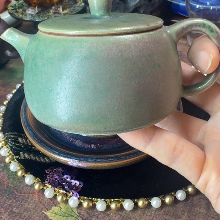 熠羽毛球的钧瓷壶壶