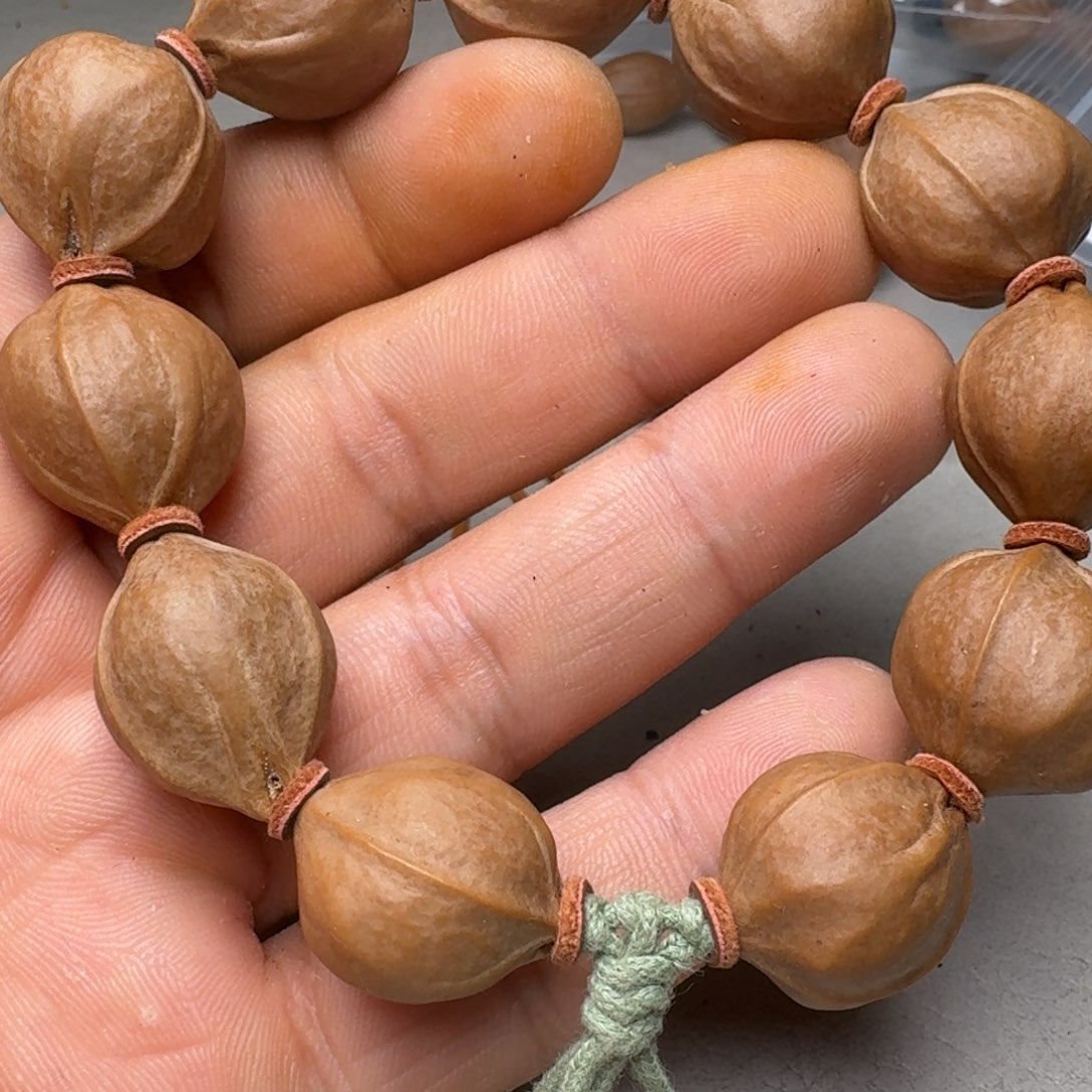 狄***_橄榄核手串橄榄核