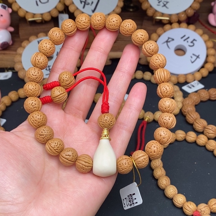 桃核手串长****了三道筋12.5误差0.5之间