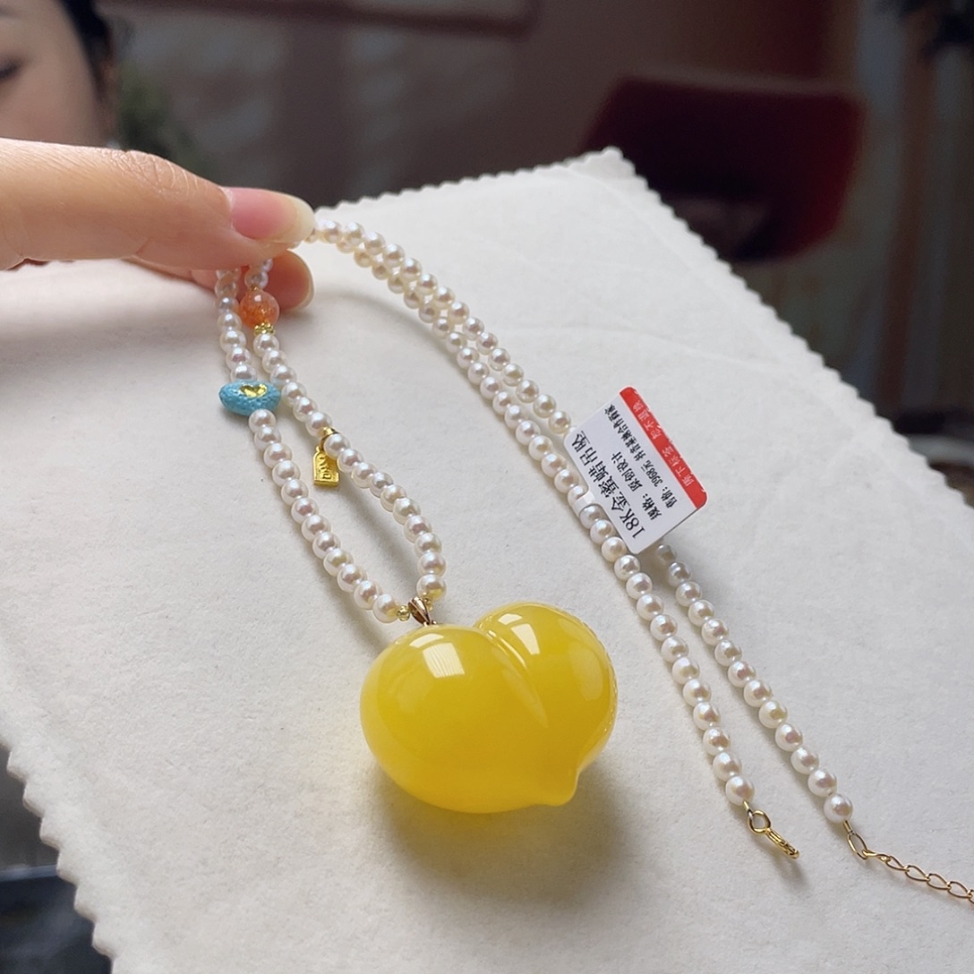 琥珀18K金镶嵌裸石吊坠