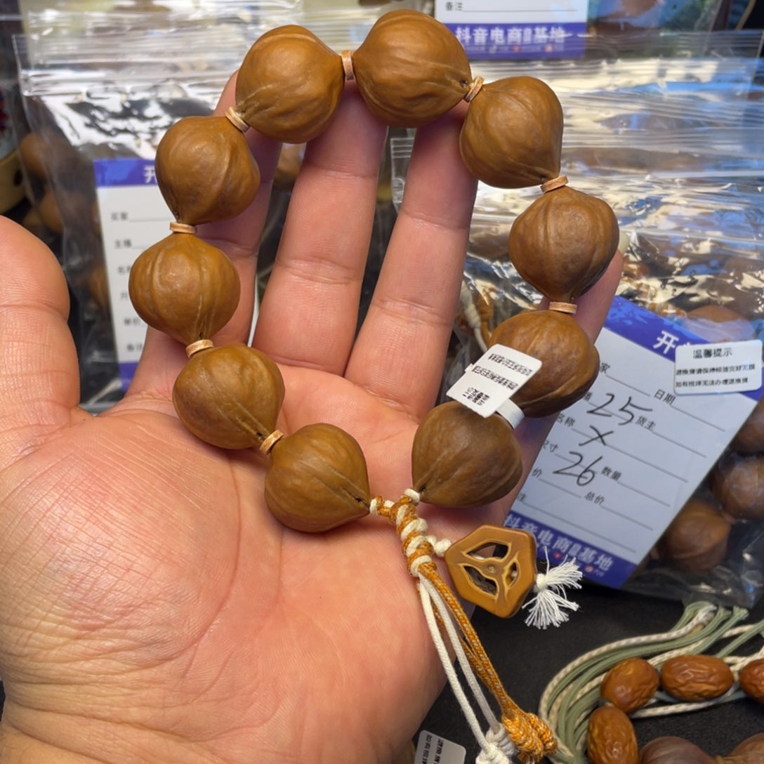 晚****手串橄榄核百万水晶核24x26mm