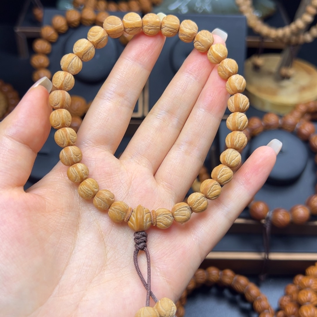 熙***良桃核手串野生玉龙脊0.9