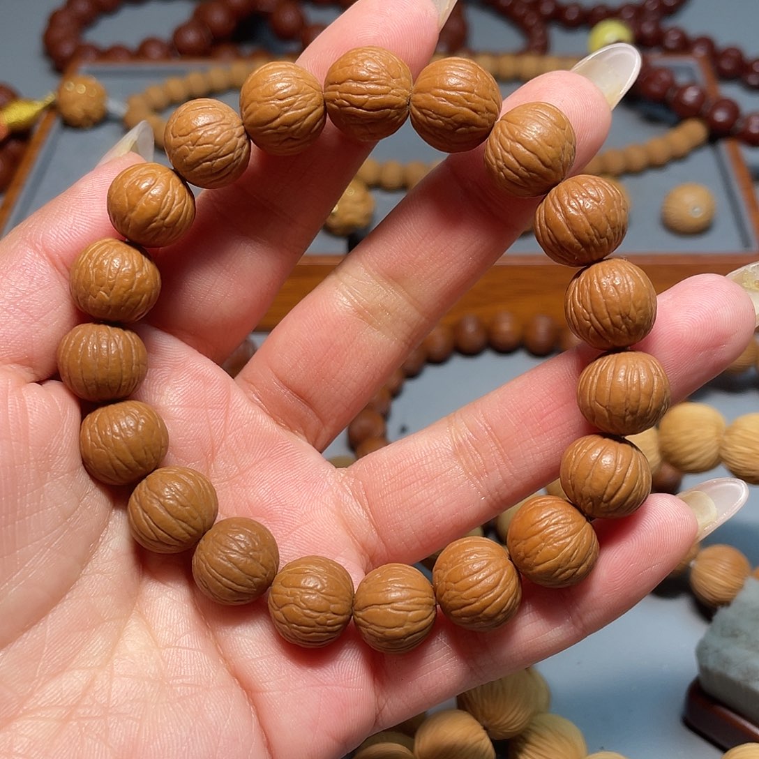 王***强猴头核桃手串凤羽