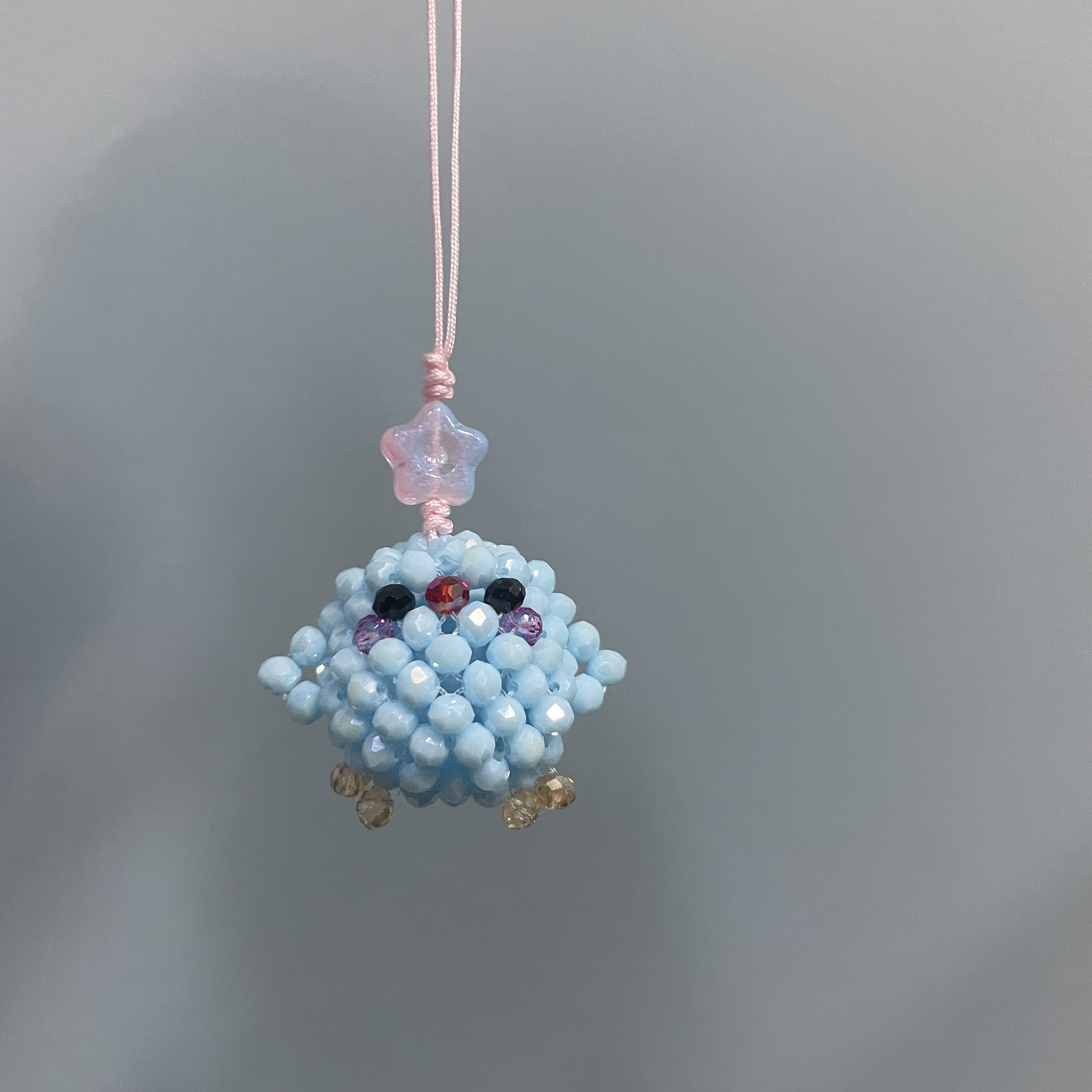 绳款编织仿玉兰企鹅手机坠E537