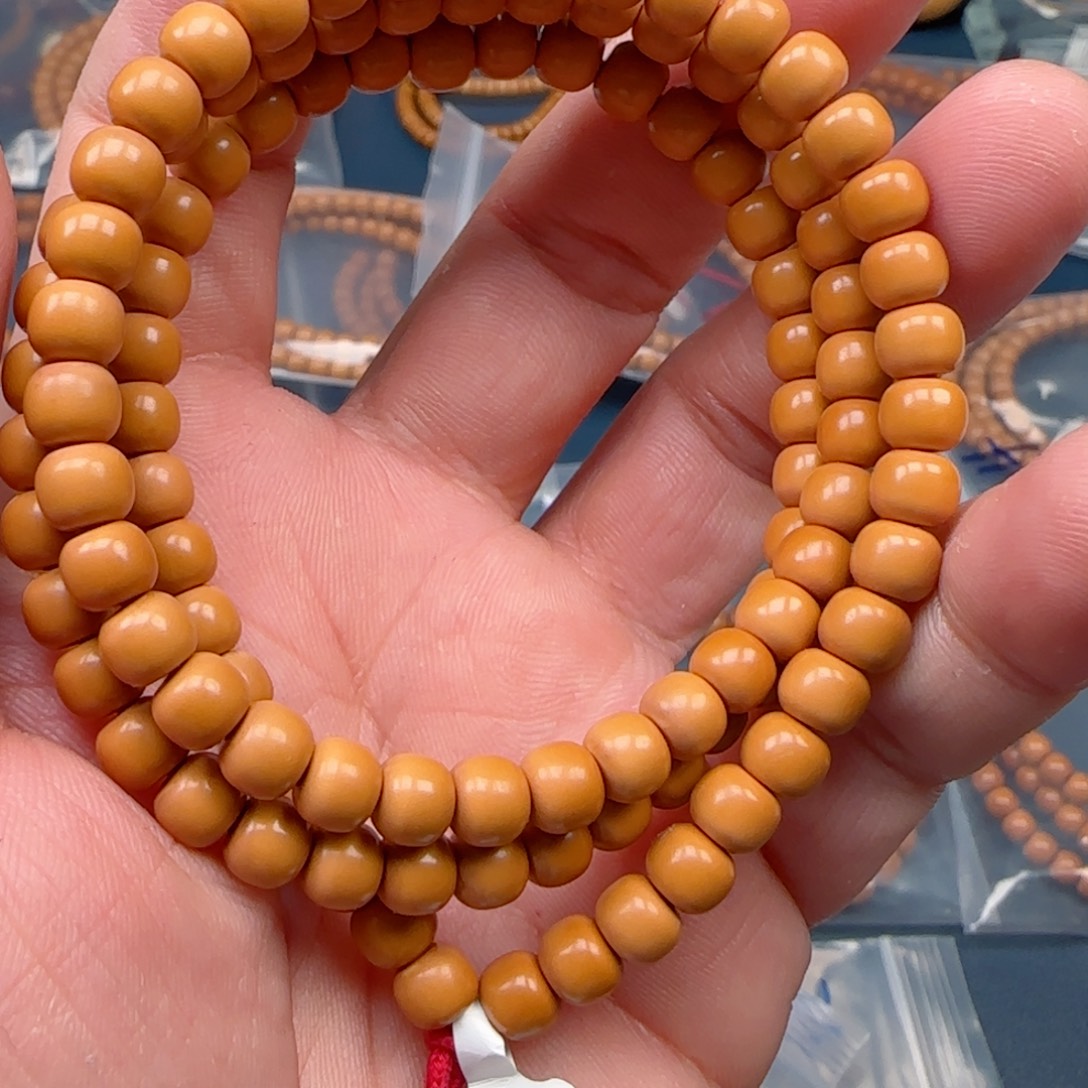 飘***橄榄核手串老挝SS级核尖极限弧尺寸6.6全无白微变色