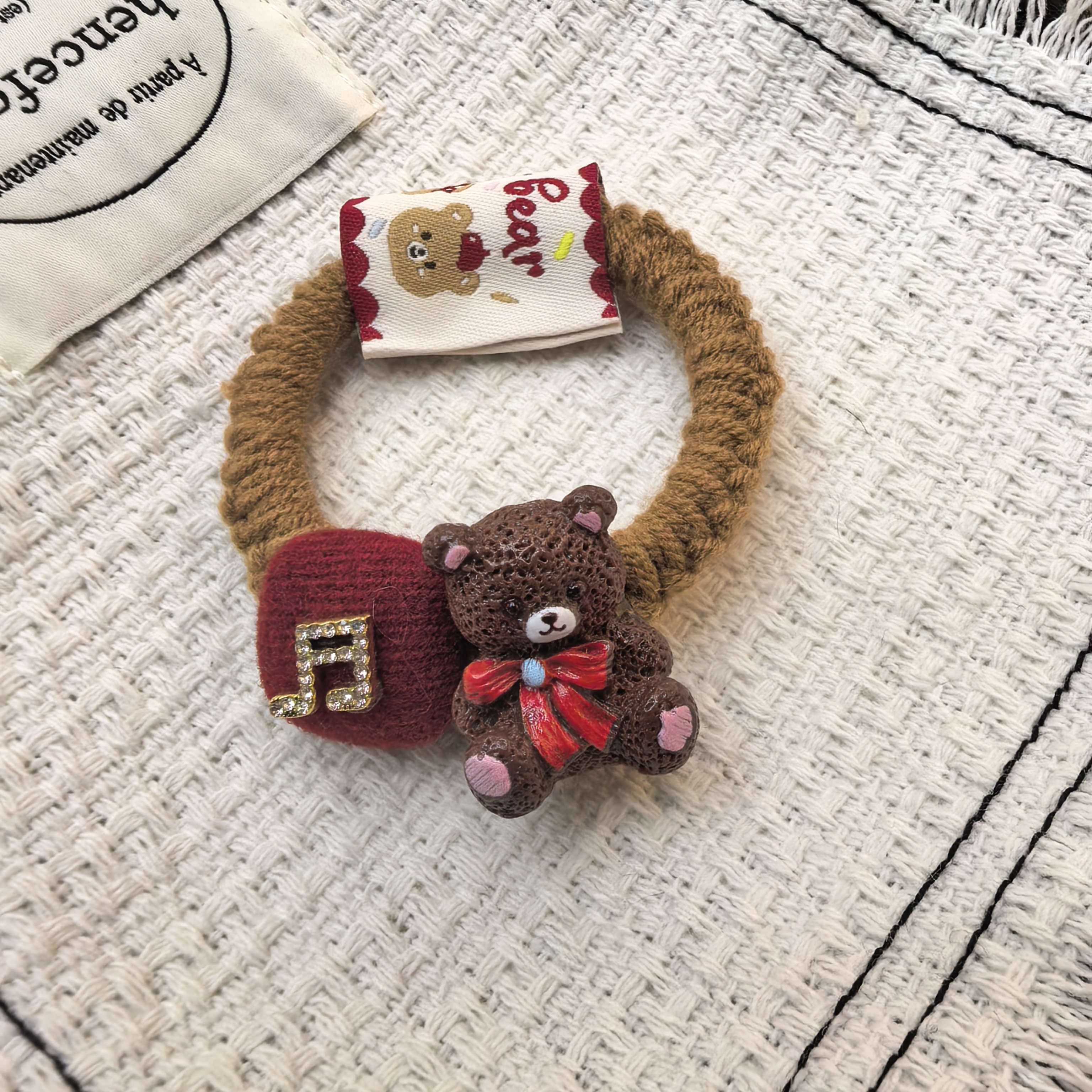 F455咖色小熊音符闪闪发绳