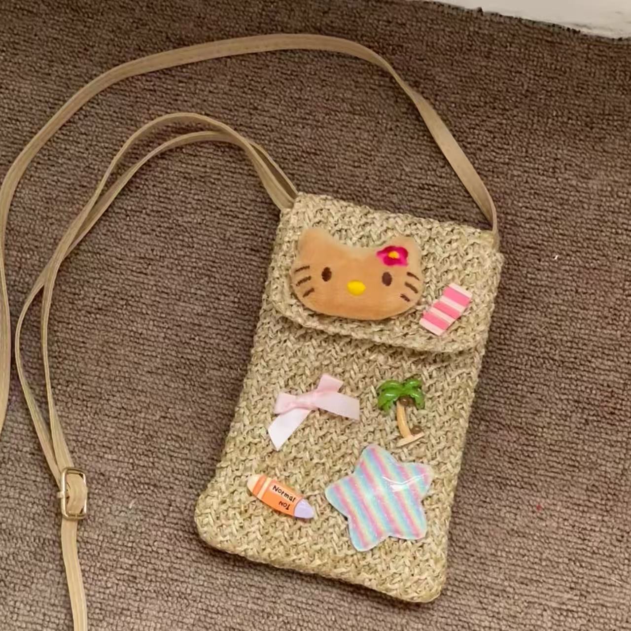 可爱度假HelloKitty编织手机包夏威夷黑皮kt猫斜挎眼镜相机包腰包