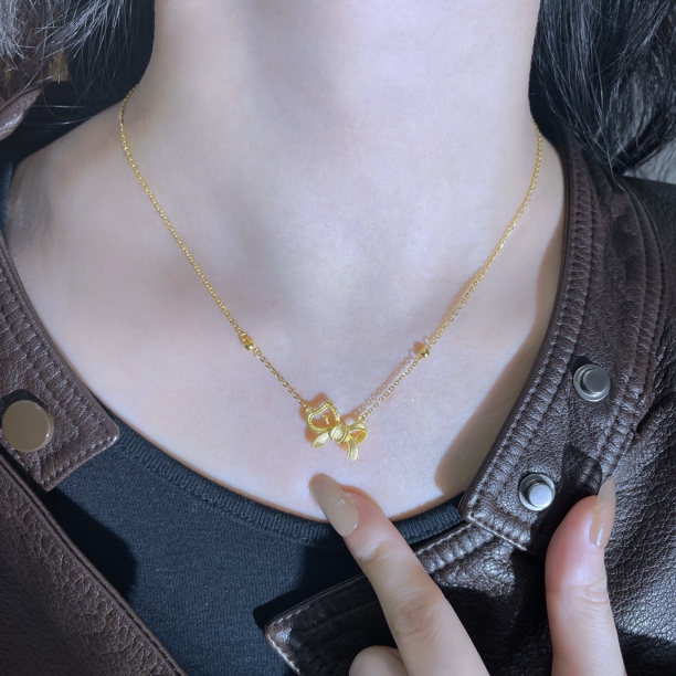 5G工艺足金999镂空蝴蝶结小马套链