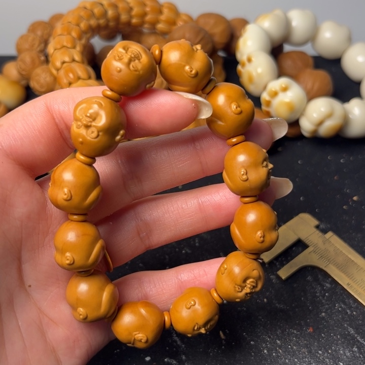 祥***顺橄榄核手串人生百态微瑕