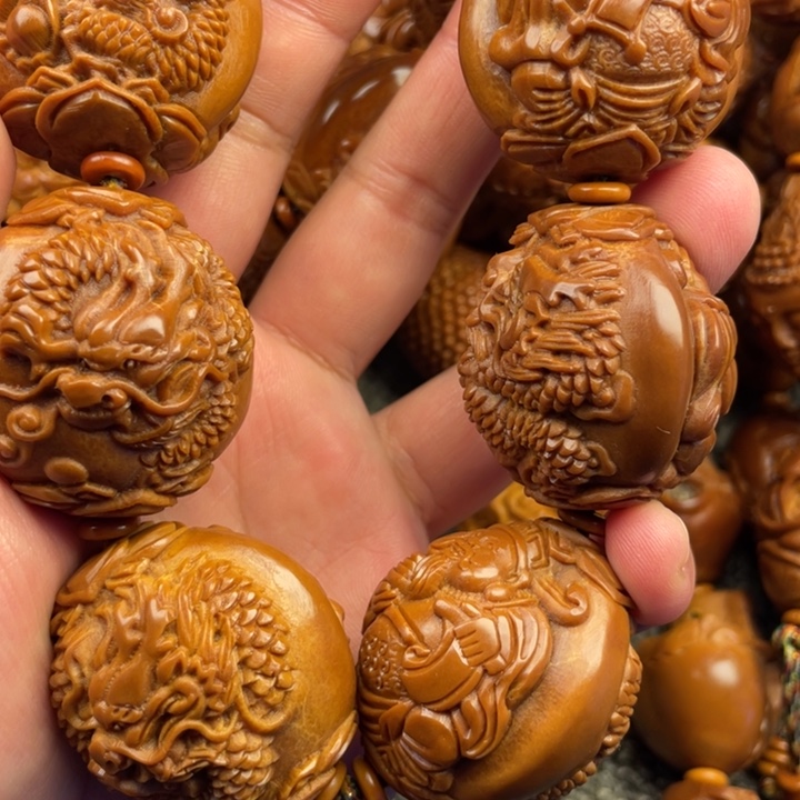 橄榄核吊坠青****悦橄榄核手持