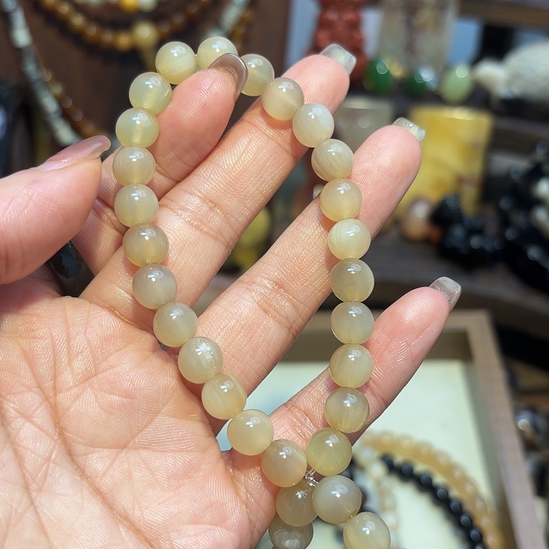 卓***依非金属玉化牛角单圈