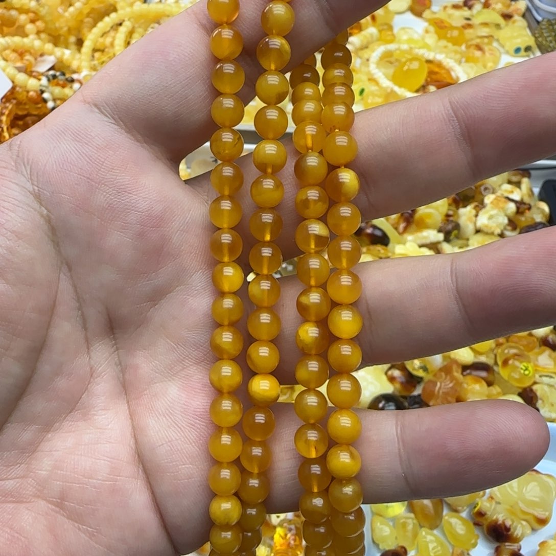 琥珀未镶嵌裸石6.5mm烤色微瑕20.2克