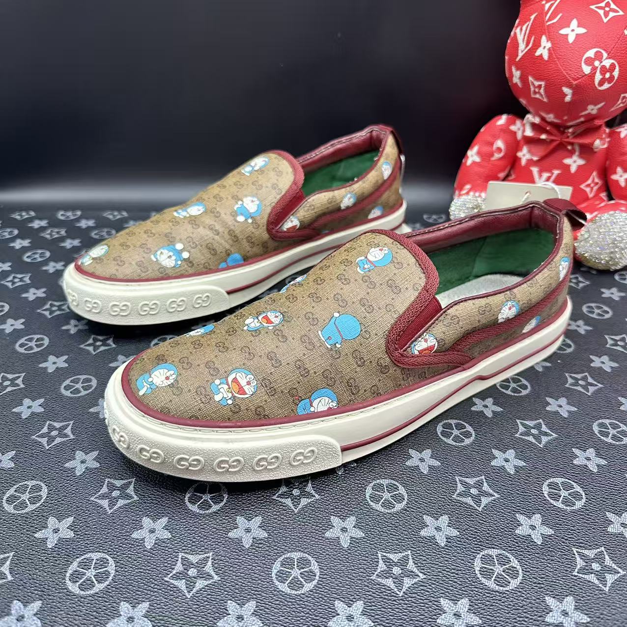 95新 GUCCI/古驰 哆啦A梦联名乌木色双G一脚蹬41欧码 ddm3038