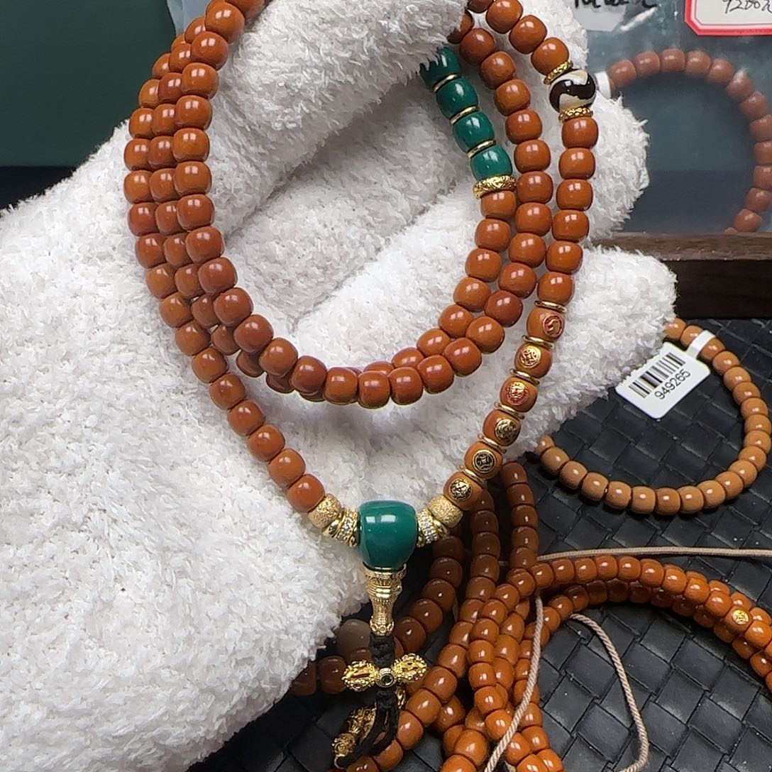 蜗***大橄榄核吊坠6.6mm老挝核尖极限弧108