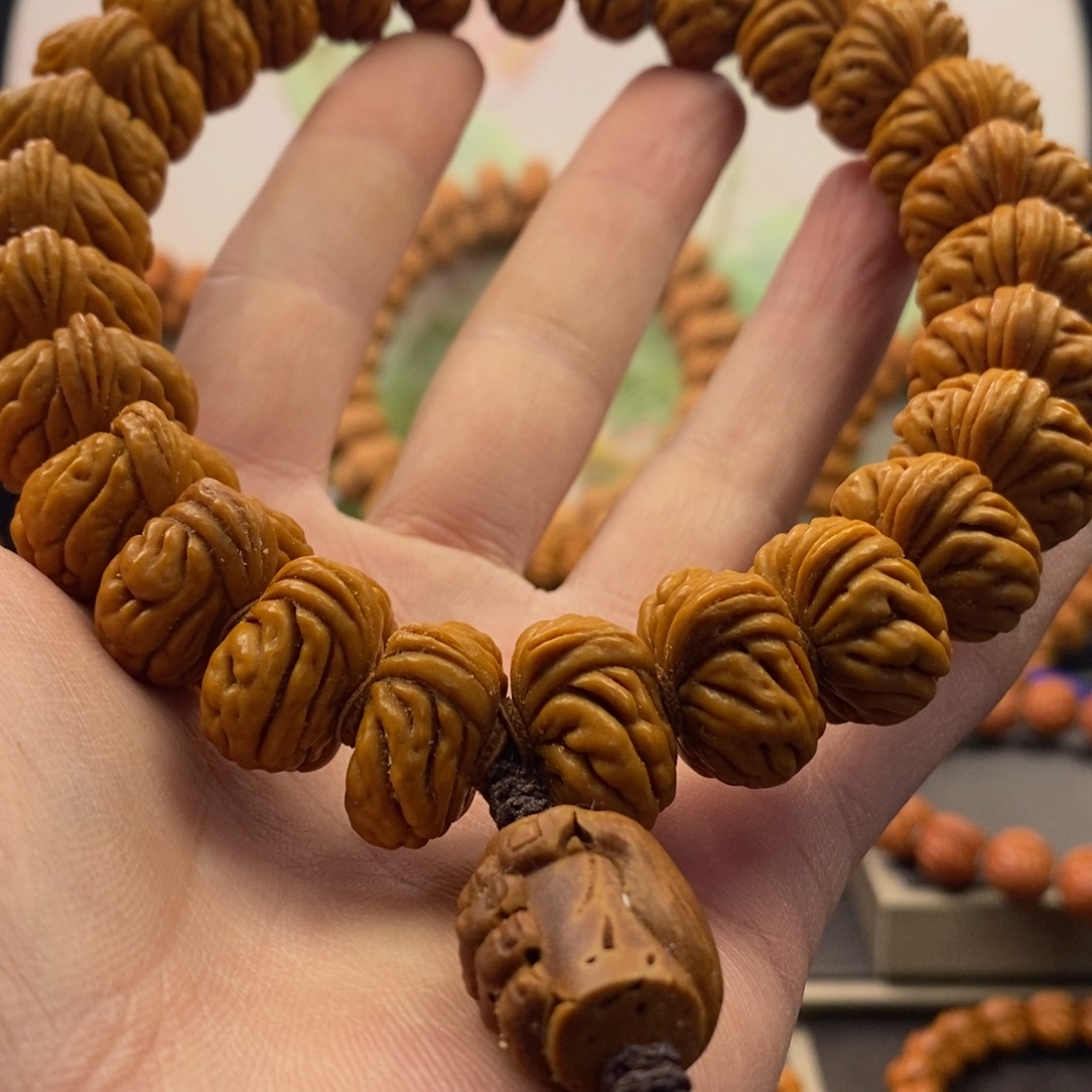 桃核吊坠南**隔大肠桃核手持