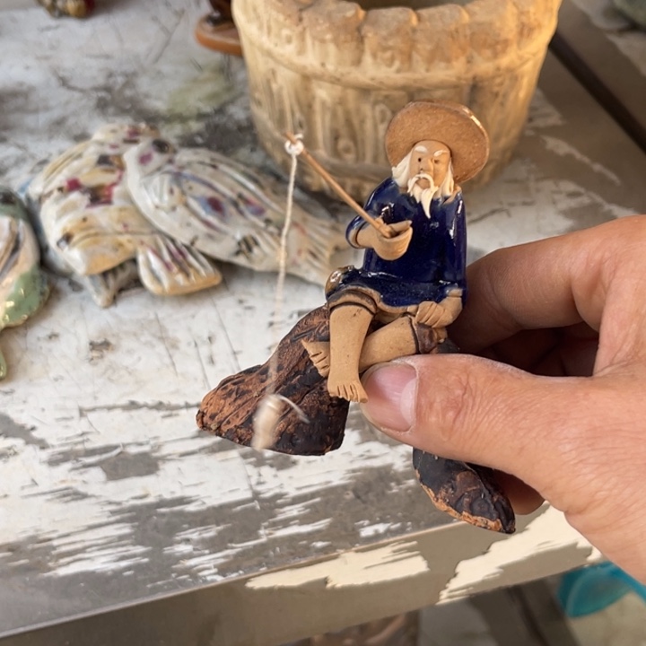 薛***崇石湾公仔衬托盆景漂亮