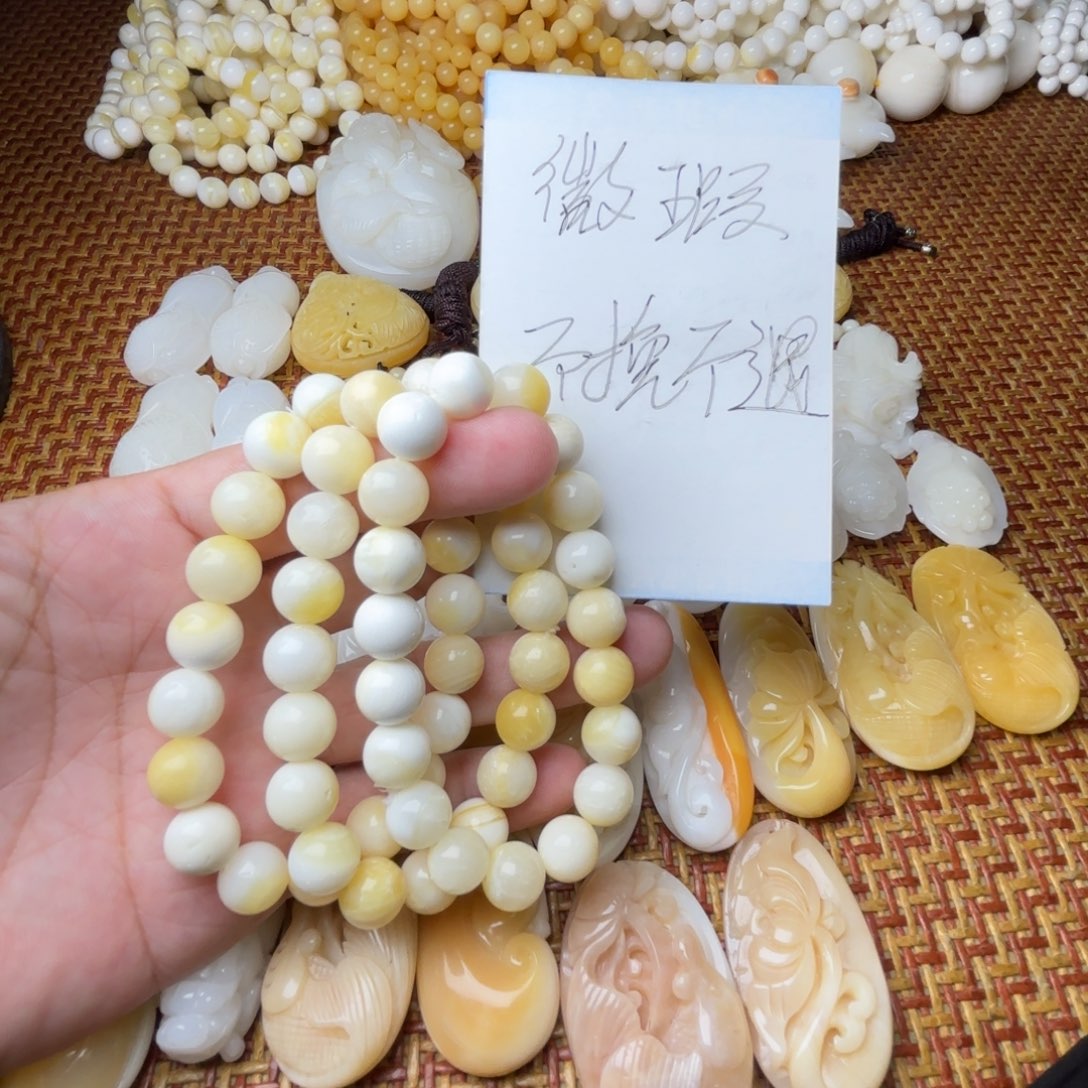 非金属贝壳微瑕卡10带黄手串