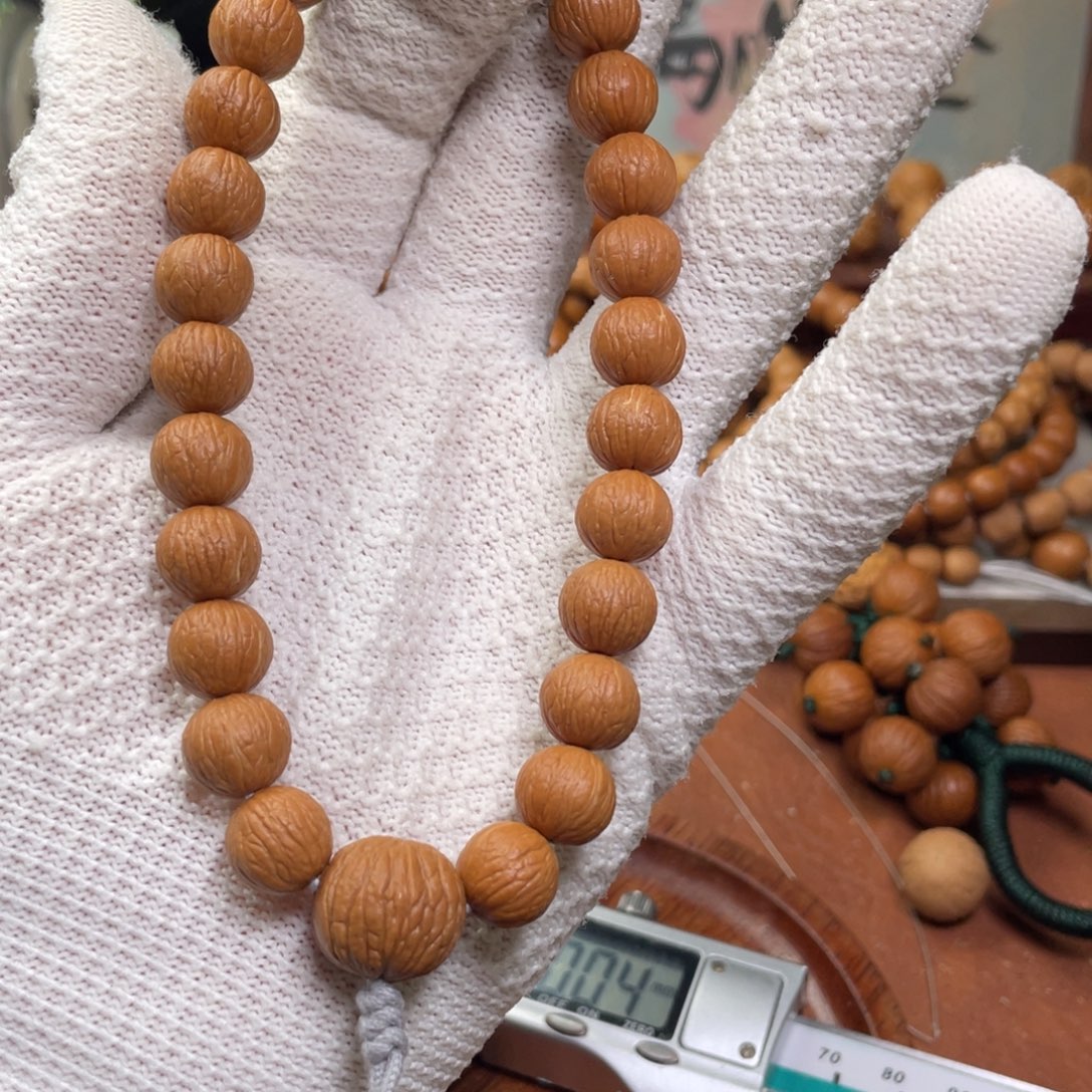 *****猴头核桃手串凤羽