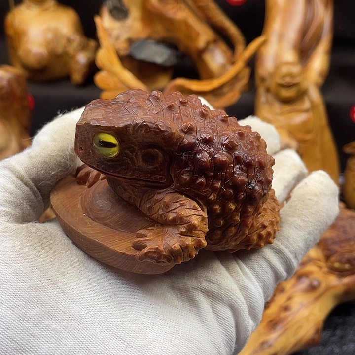 育***记柏木（崖柏）呱呱来财手把件