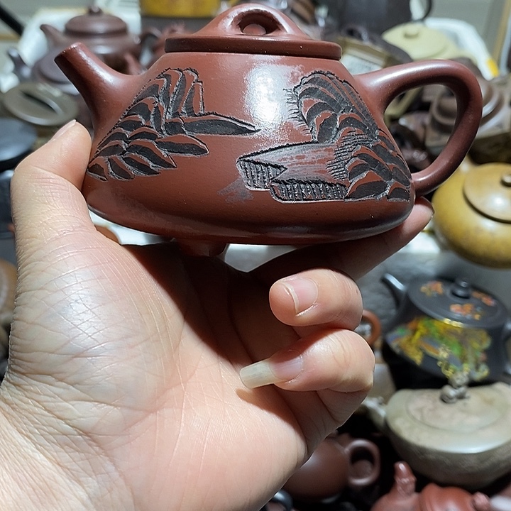 紫砂茶壶摩擦微笑