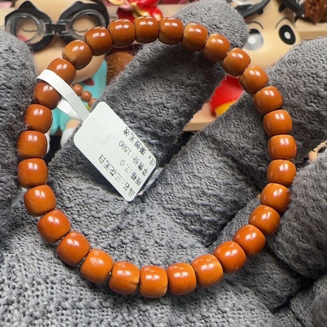 富***儿手串橄榄核老挝单圈三花极限弧7.0福利