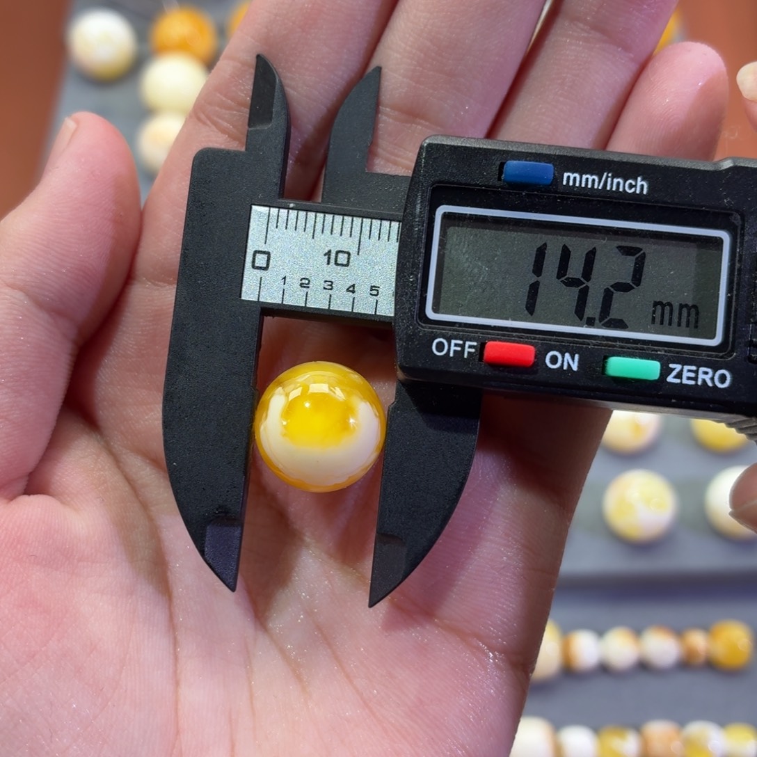 幸***星琥珀未镶嵌裸石圆珠