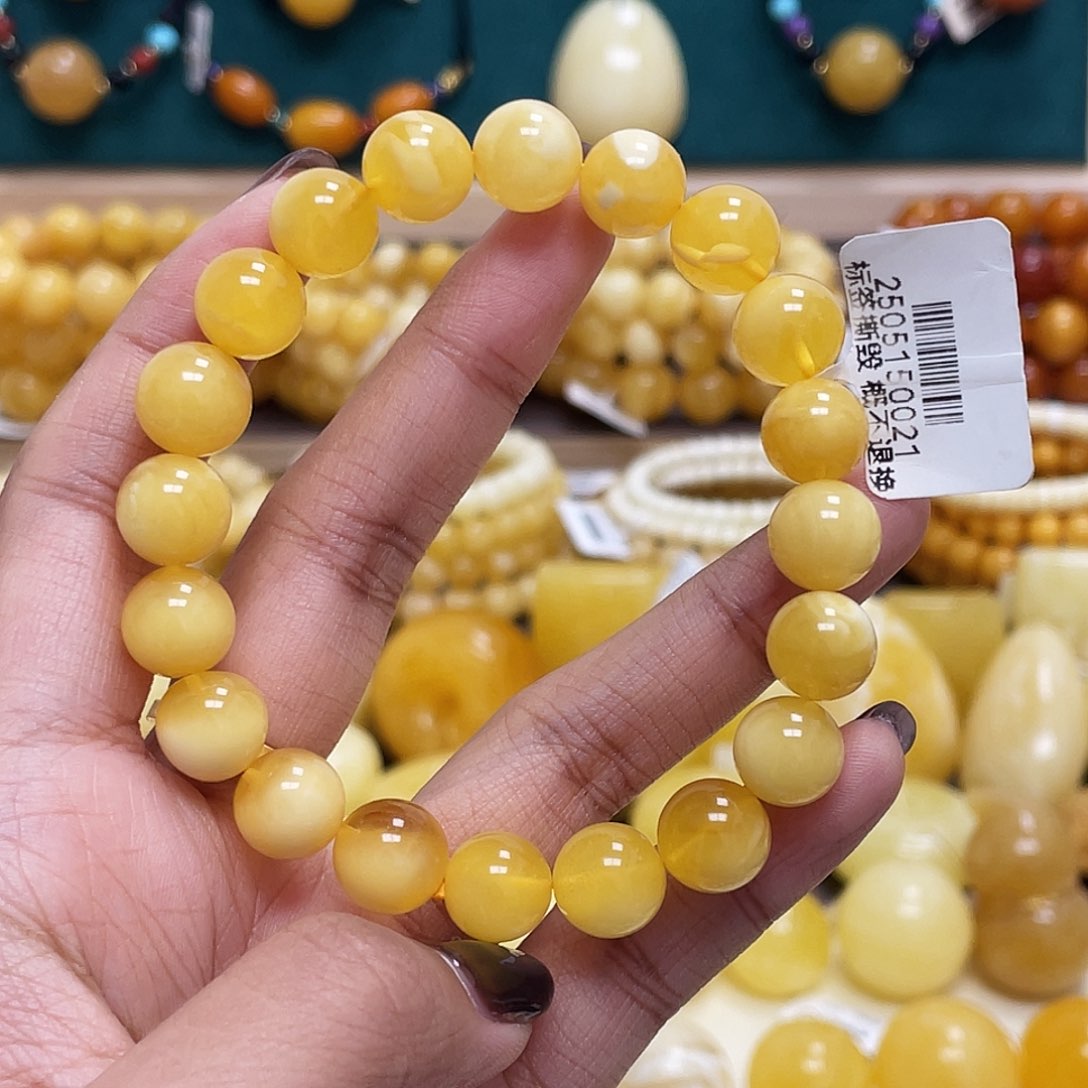 蜜蜡未镶嵌珠宝奇石是**啊10+mm金白妖花圆珠手串瑕