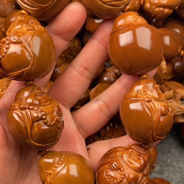 橄榄核吊坠一**光橄榄核手持