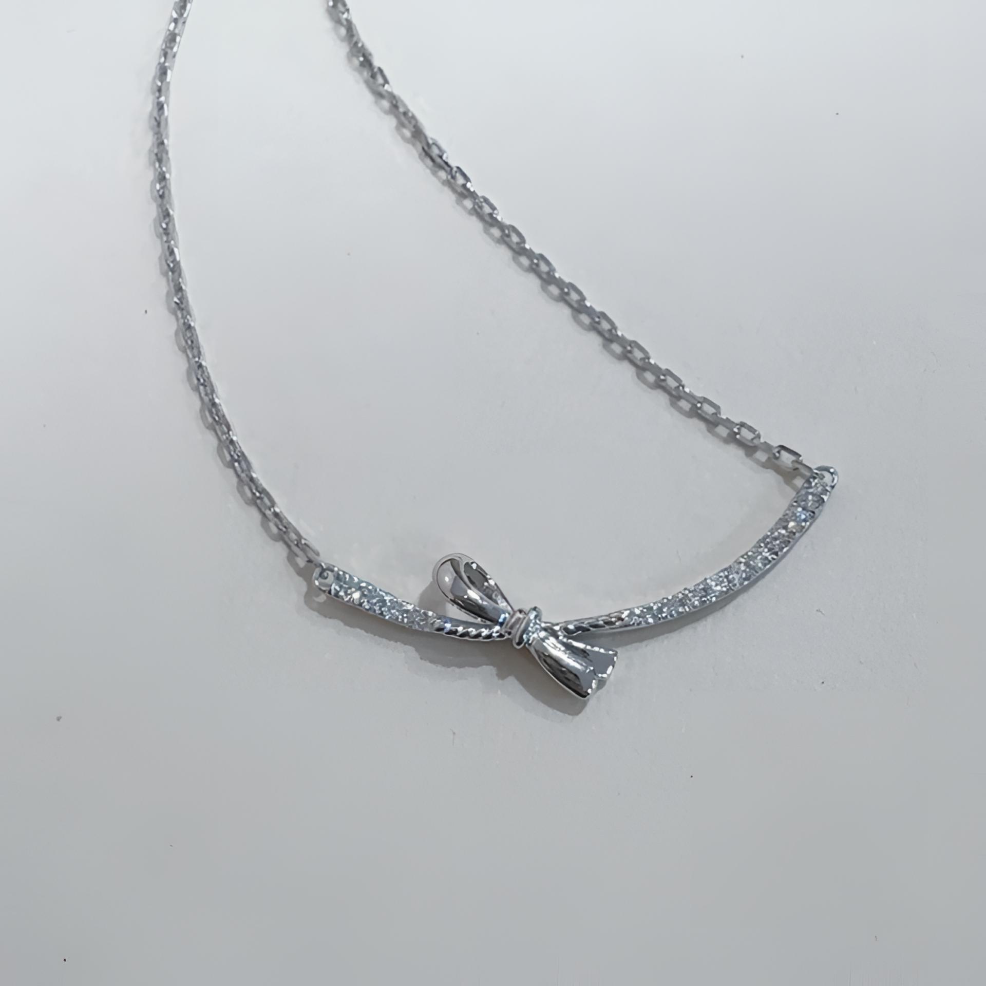 铂金蝴蝶结笑脸镶嵌套链