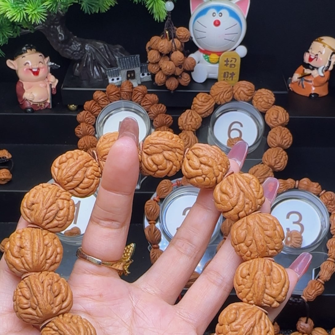 啰***人吊坠桃核霸王龙手持