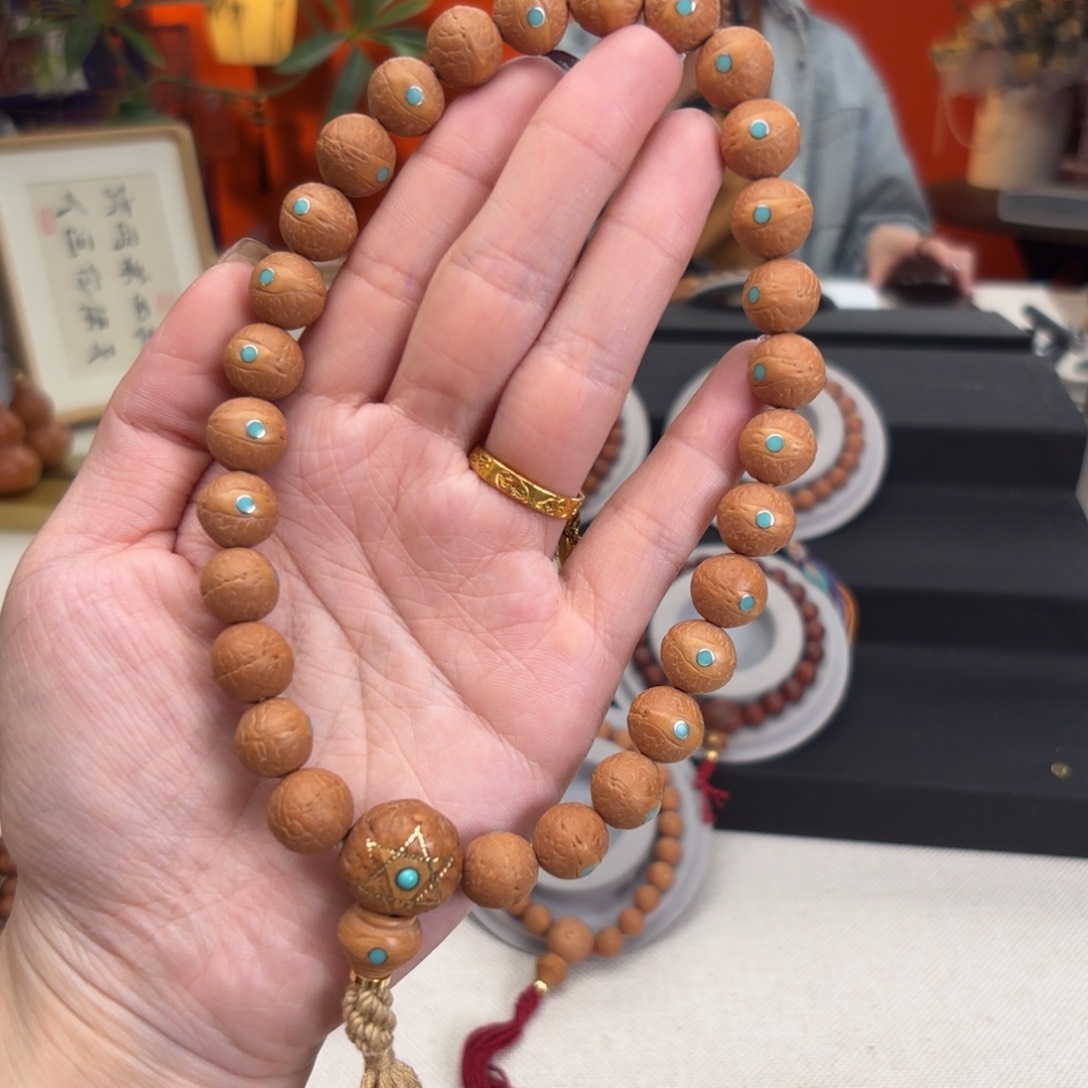 凤眼菩提吊坠12毫米手持铜