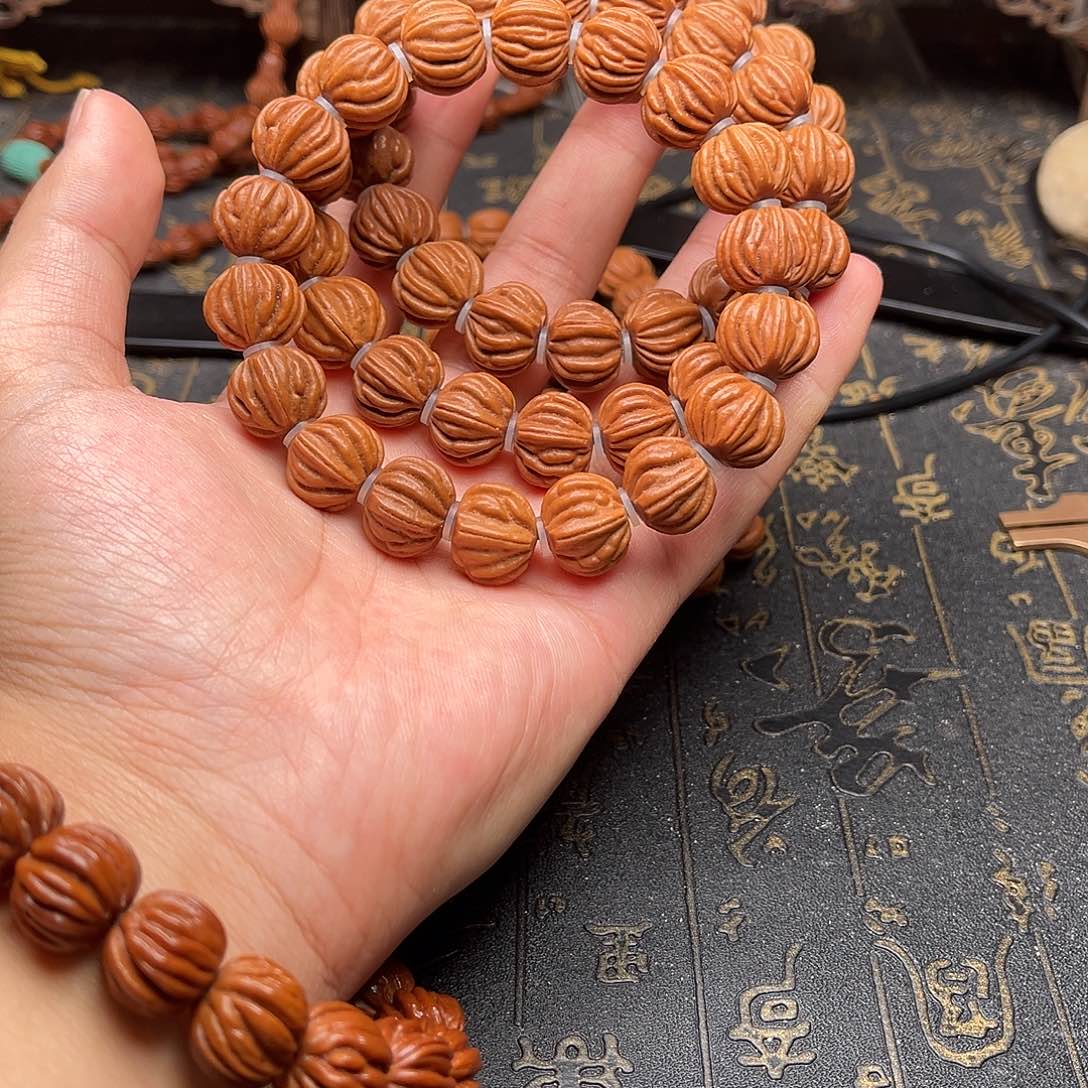 桃核吊坠佛手手串