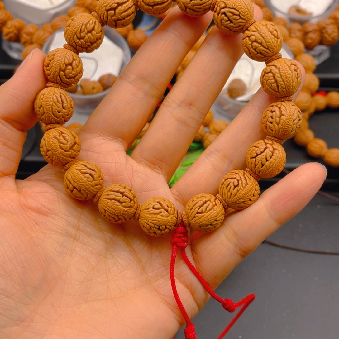 亚***援吊坠桃核见健健康康平平安安9