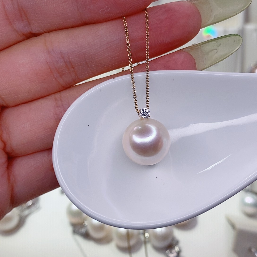 莎***°淡水珍珠18K金镶嵌吊坠(赠链)