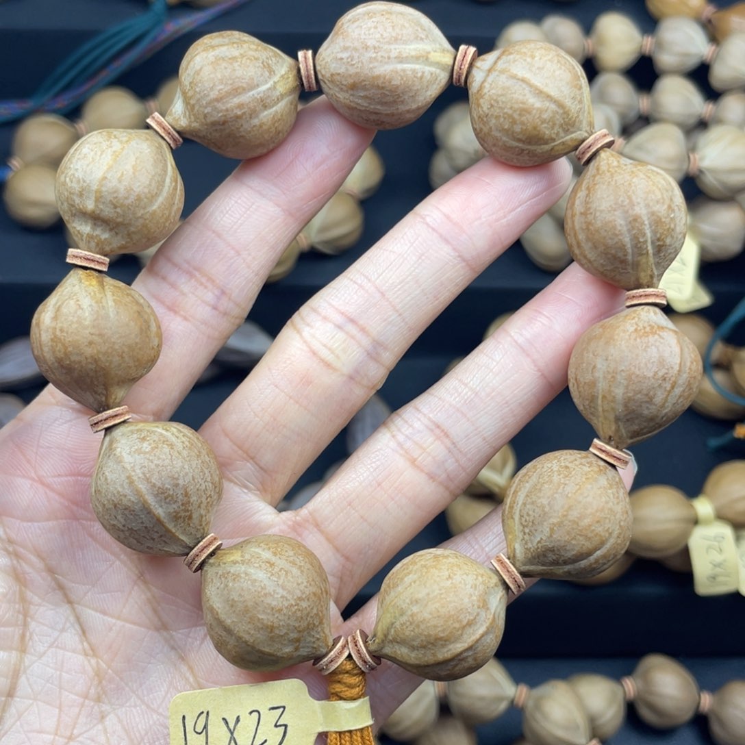 杨***g002橄榄核三花19*23