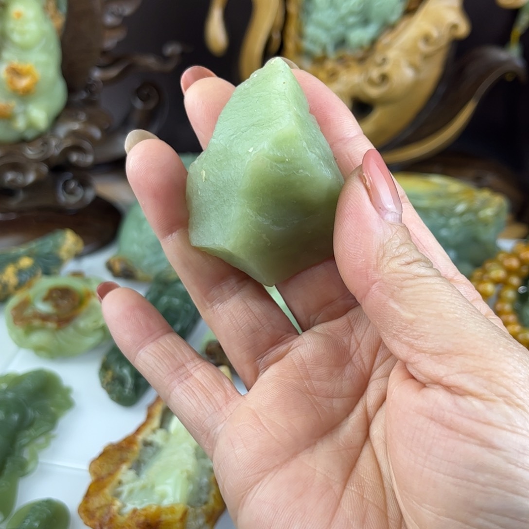 蛇纹石玉手把件合金