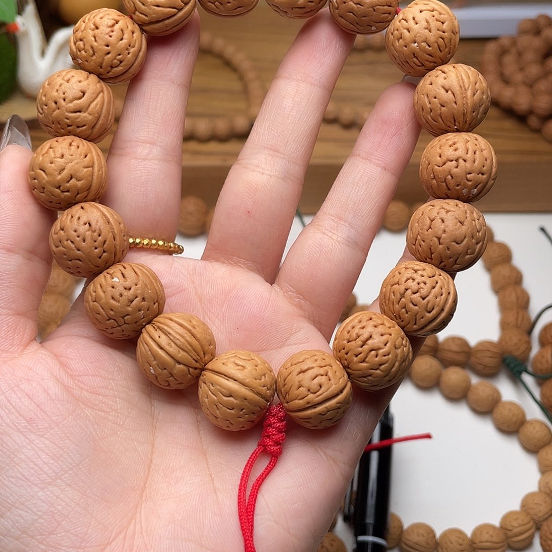 阙***e17野生灯笼桃核手持