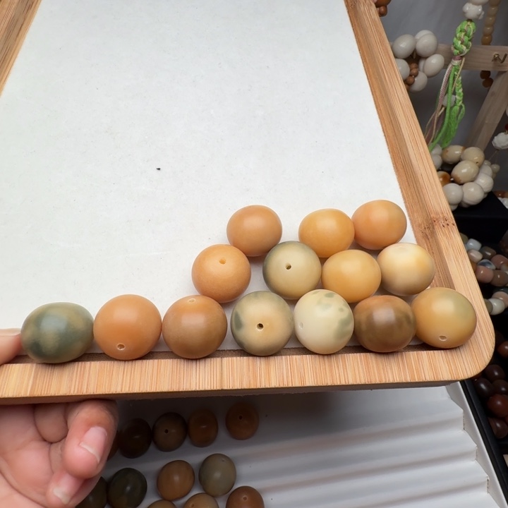鱼***间菩提根/象牙果手串干磨瑕疵
