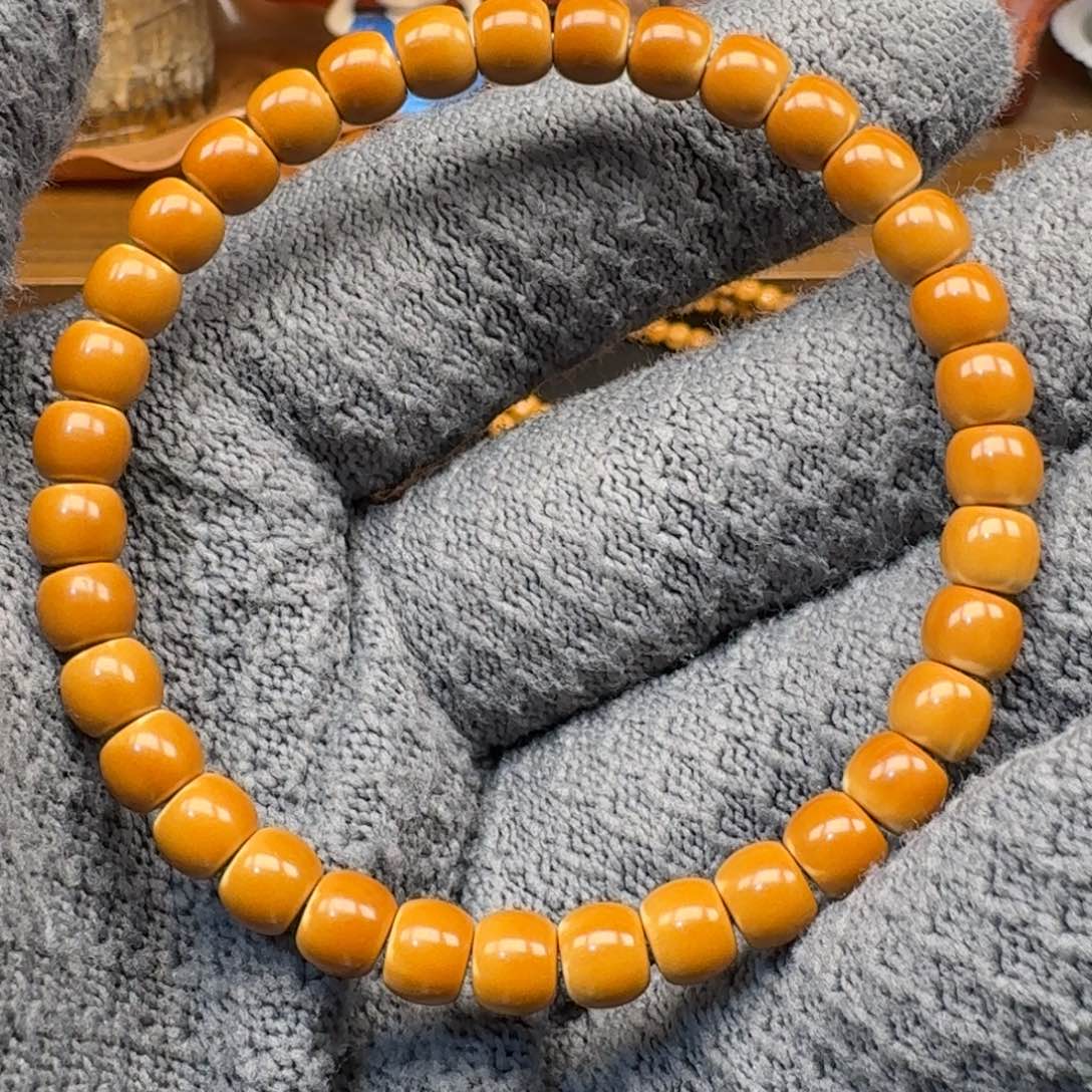 胖****手串/手链橄榄核6.6老挝正三花核尖单圈微微白