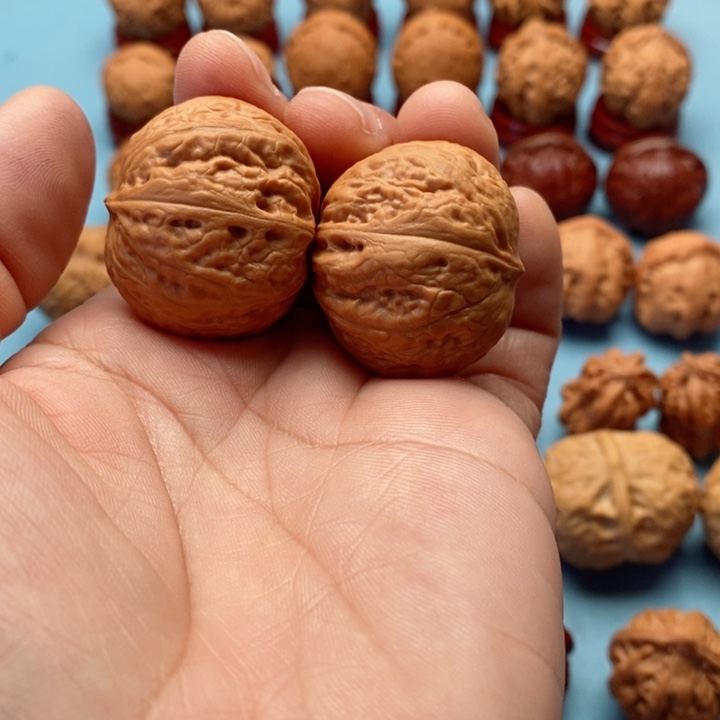 文玩核桃把件精品文玩手捻元宝墎元