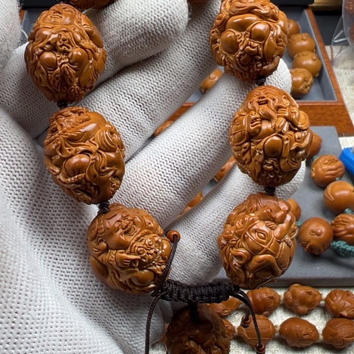 橄榄核手串万****?橄榄核雕工艺制作