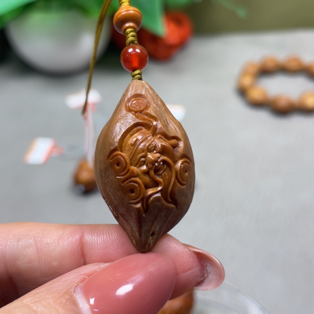 橄榄核吊坠顾卫东包衣财神单子