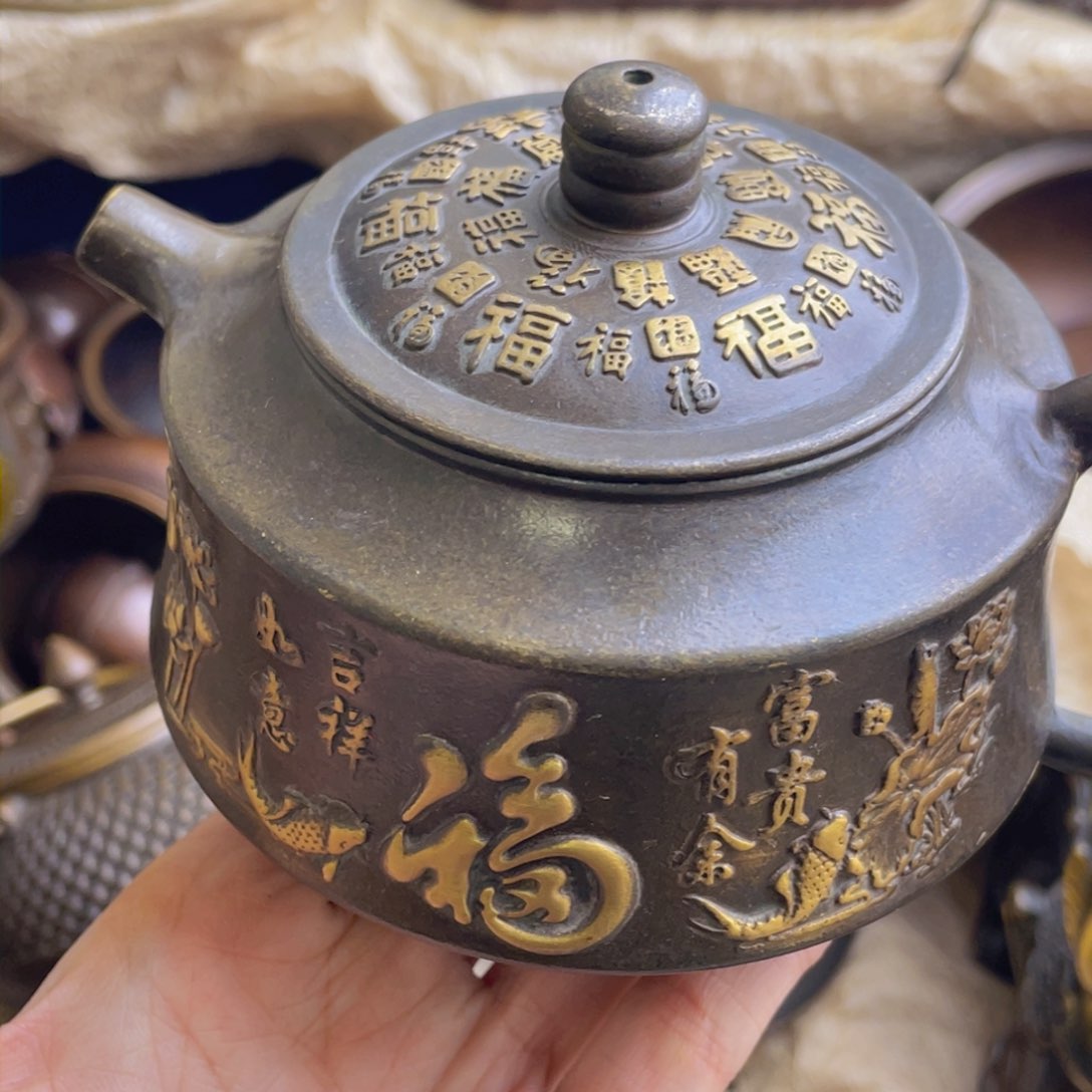 原矿风磨铜茶壶。