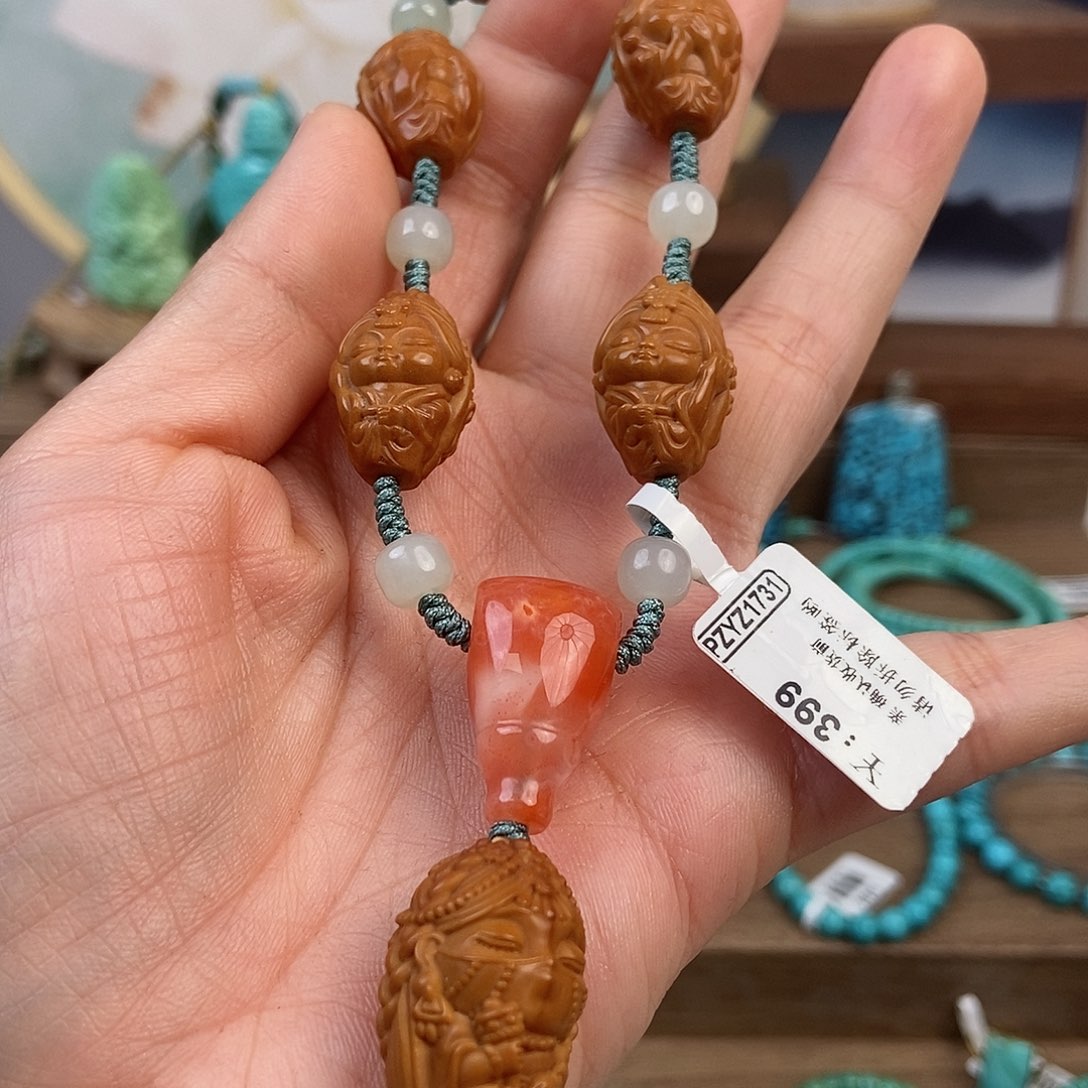 橄榄核手串扎基不说不听不看