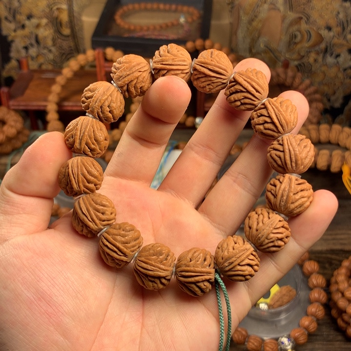 桃核手串19龙鳞凤尾 