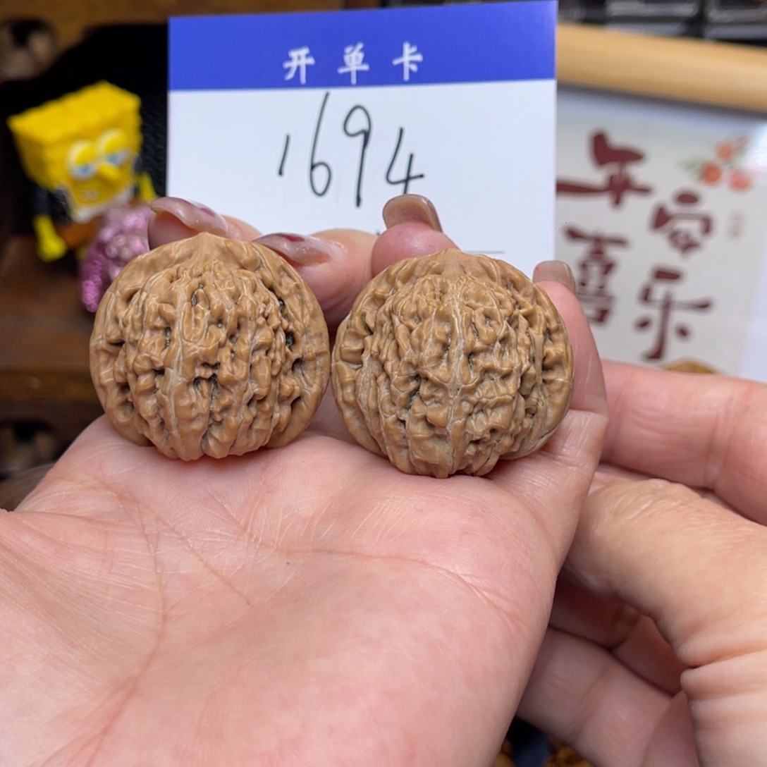 桃核把件?平谷楼33李。   