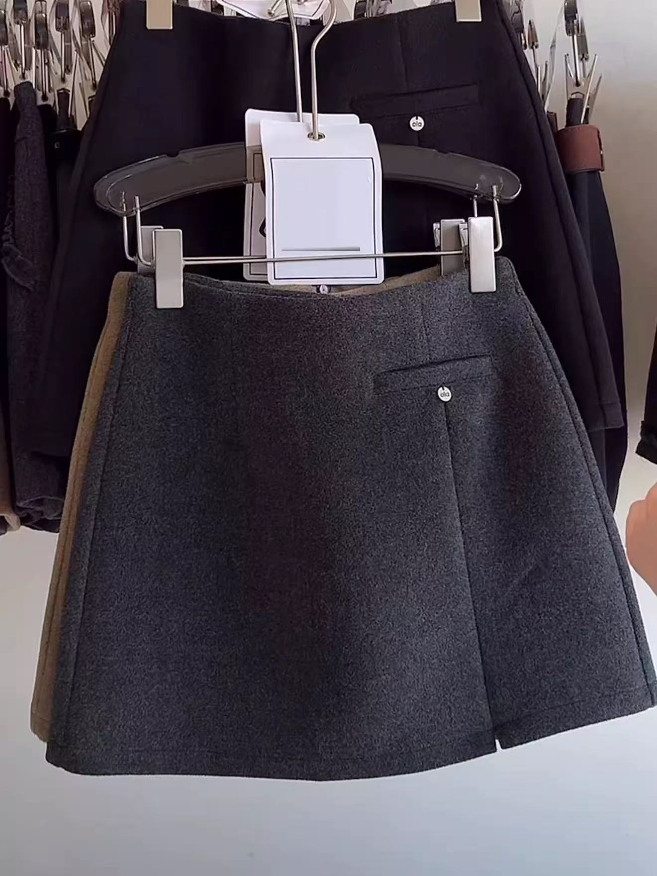 新款短裙纯色休闲风Chic风高腰半身裙不规则毛呢时尚百搭