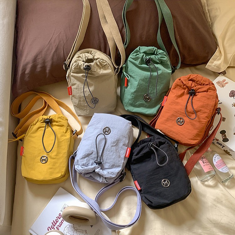 男女同款多功能运动手机包单肩户外休闲水杯包斜跨百搭